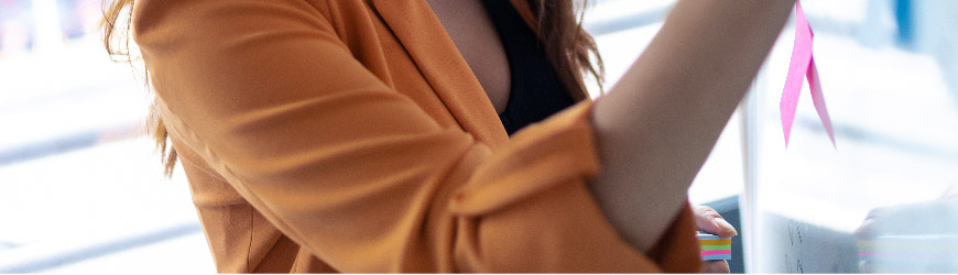 Business analyst writing on whiteboard